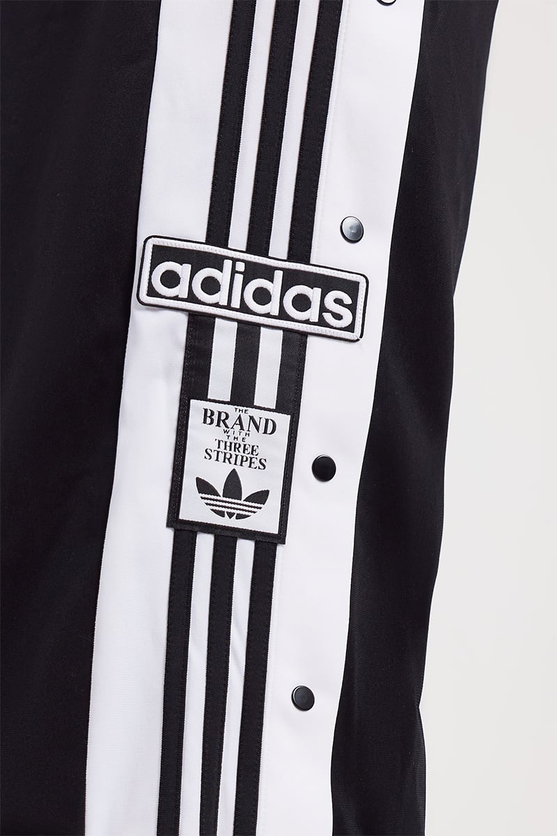 adidas Originals adicolour three stripe logo relaxed fit track pants in  black