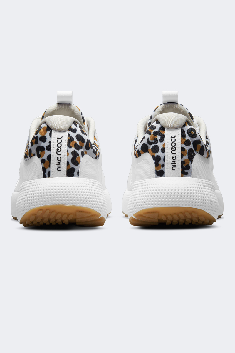 nike running escape run sneakers in white and gold